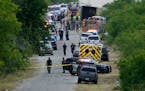 Police work the scene where dozens of people were found dead in a semitrailer in a remote area in southwestern San Antonio, Monday, June 27, 2022. 