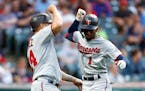 Minnesota Twins' Nick Gordon (1) celebrates with Gary Sanchez after hitting a two-run home run against the Cleveland Guardians during the sixth inning