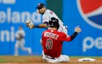 Twins second baseman Luis Arraez turned a double play on Monday night against the Guardians in Cleveland.