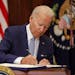 President Joe Biden signs the Bipartisan Safer Communities Act into law in the Roosevelt Room of the White House on Saturday, June 25, 2022.