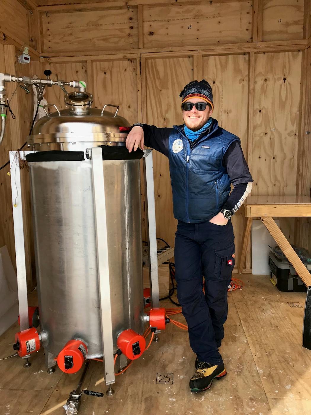 Glaciologist and climate scientist Peter Neff next to a custom-built ice melter during a joint U.S.-Australian expedition to Antarctica in the 2018-2019 research season.