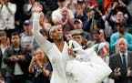 Serena Williams waves as she leaves the court after losing to France’s Harmony Tan in a first round women’s singles match on day two of Wimbledon