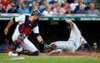 Carlos Correa of the Twins beat the tag of Cleveland catcher Luke Maile in the second game of Tuesday’s doubleheader at Progressive Field.