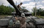 A Ukrainian T-64BV comes off the frontline for repairs in Bakhmut, in eastern Ukraine, on Wednesday, June 29, 2022. 