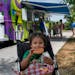 Sabela Bazan Sánchez, 3, enjoyed a cheeseburger with fries and milk Wednesday at Phalen Beach in St. Paul, courtesy of a St. Paul Public Schools food