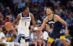 Timberwolves forward Anthony Edwards handled the ball against Grizzlies forward Kyle Anderson. The two are now teammates in Minnesota.