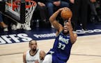 The Minnesota Timberwolves' Karl-Anthony Towns (32) goes up for a dunk against the Memphis Grizzlies in the second quarter  during Game 6 of the Weste