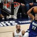 The Minnesota Timberwolves' Karl-Anthony Towns (32) goes up for a dunk against the Memphis Grizzlies in the second quarter  during Game 6 of the Weste