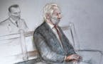 This is a court artist sketch by Elizabeth Cook of Julian Assange appearing at the Old Bailey in London for the ruling in his extradition case, in Lon