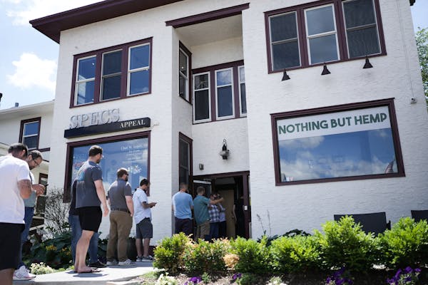 Customers lined up out the door to purchase newly-legal THC edibles at Nothing But Hemp on St. Paul’s Grand Avenue on Friday, July 1, 2022. ] MARK V