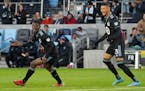 Bakaye Dibassy, left, and Kervin Arriaga celebrated a goal at Allianz Field on April 16, 2022.