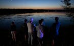 Friends and relatives gathered Friday at Vadnais Lake after hearing news that a child’s body was pulled from the east-metro lake. A search was conti