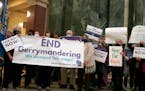 FILE - More than 100 opponents of the Republican redistricting plans vow to fight the maps at a rally ahead of a joint legislative committee hearing a
