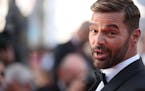 FILE - Ricky Martin poses for photographers upon arrival at the premiere of the film ‘Elvis’ at the 75th international film festival, Cannes, sout