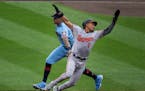 The Orioles’ Richie Martin was tagged out by Twins shortstop Carlos Correa in the fifth inning at Target Field on Sunday.
