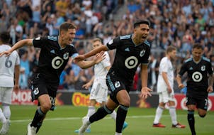 Minnesota United midfielder Emanuel Reynoso celebrated a first-half goal with midfielder Wil Trapp against Real Salt Lake at Allianz Field on Sunday.