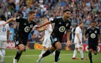 Minnesota United midfielder Emanuel Reynoso celebrated a first-half goal with midfielder Wil Trapp against Real Salt Lake at Allianz Field on Sunday.
