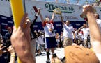 Joey Chestnut, center left, won his 15th Nathan’s Famous Fourth of July hot dog eating contest in Coney Island on Monday.