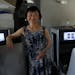 Kim Phuc poses for a picture in a humanitarian flight transporting refugees fleeing the war in Ukraine to Canada, from Frederic Chopin Airport in Wars