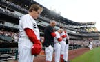 White Sox manager Tony La Russa, left, and his coaches bowed their heads during a moment of silence Monday at Guaranteed Rate Field.