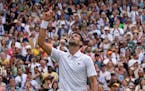 Novak Djokovic celebrates after beating Jannik Sinner in a men’s singles quarterfinal match on day nine of Wimbledon