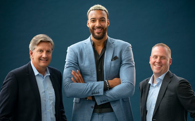 Rudy Gobert was flanked by Wolves coach Chris Finch, left, and team president Tim Connelly on Wednesday at Target Center.
