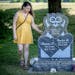 Jessica Peterson at her children’s tombstone at a cemetery near her home in River Falls, Wis. Peterson will soon release a book about her three girl