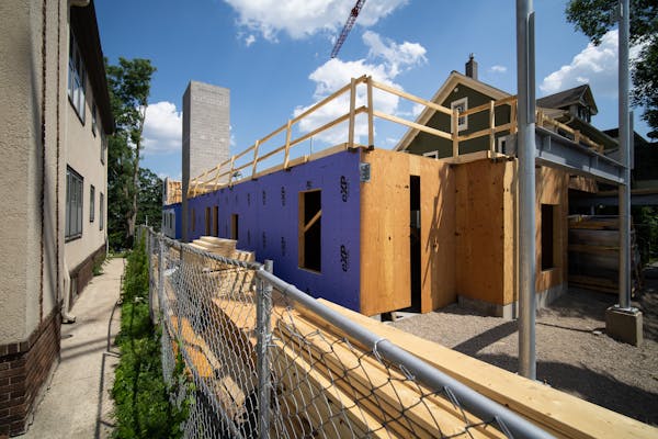 Construction on a small apartment building in Uptown in Minneapolis, Minn., on Monday, June 27, 2022. 3333 Hennepin Avenue was designed in response to