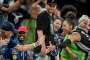 Lynx forward Aerial Powers celebrated with fans at Target Center during the second half of a double overtime win over Phoenix on Tuesday.