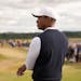 Tiger Woods was back at it Thursday, working his way through the first round of the British Open.