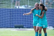 Aurora players Rachel Preston (29) and Mariah Nguyen celebrated after their 1-0 victory over McLean on Sunday at TCO Stadium in Eagan.