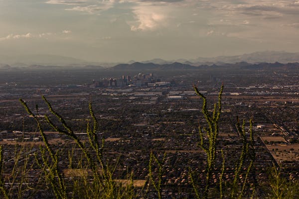 A view of the skyline in Phoenix, where the temperature reached or exceeded 110 degrees on 50 days in 2020, July 17, 2022. Climate change remains an i