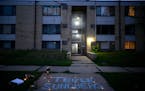 Tekle Sundberg’s name is written in chalk during a vigil for 20-year-old Sundberg on July 14 outside the apartment building where he was killed by M