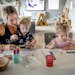 Joanna Kraus entertained her children Cal, 15-months, and Cora, 3, with art at their home during their busy morning in Shakopee on Tuesday.