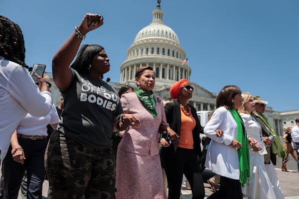 Democratic lawmakers take part in an abortion rights rally outside the Capitol on Tuesday. At least 17 House Democrats, including Rep. Ilhan Omar, wer