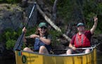 Wilderness Inquiry trip leader Ryan Stumbo paddles in the BWCA with Andrew, one of the participants on a journey that was exclusively for people who a
