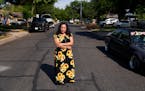 Francisca Acuña, who works as an activist around climate issues and used to teach people to buy flood insurance, poses for a photo in her neighborhoo