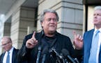 Former White House strategist Steve Bannon, center, speaks with reporters as he departs federal court on Wednesday, July 20, 2022, in Washington. Acco