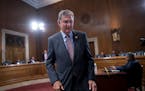Sen. Joe Manchin arrives to chair the Senate Committee on Energy and Natural Resources, at the Capitol in Washington on July 19.