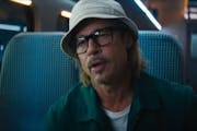 Brad Pitt boards a “Bullet Train” in his new adventure film. A caveat: He may not be as mild-mannered as the bucket hat suggests.