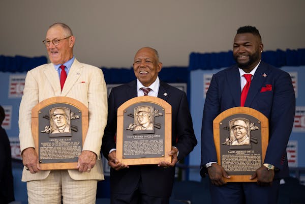 Jim Kaat, Tony Oliva and David Ortiz — three former Twins — stood on the stage after being inducted into the National Baseball Hall of Fame in Coo