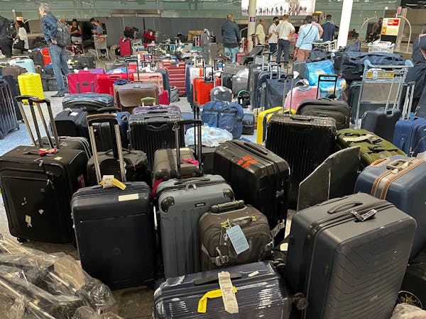 Suitcases are seen uncollected at Heathrow’s Terminal Three baggage reclaim, west of London on July 8, 2022.