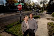 Christina Anderson-Taghioff and Simon Taghioff stood at the intersection of Victoria St. and Osceola Ave. in front of their home in St. Paul on May 7,