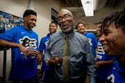 Larry McKenzie, shown here with his Minneapolis North players before a game in 2019, retired on Monday after 24 years of coaching and six state champi