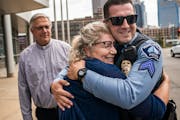 Tina Wagner hugged her son Minneapolis police Sgt. Andrew Schroeder, who was honored with the department’s Medal of Valor Wednesday for pulling the 