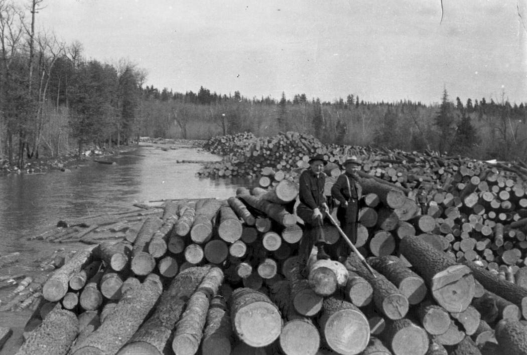 Lumberjacks fed logs into the Little Fork River in 1937 at the start of what was expected to be the last big log drive in Minnesota.