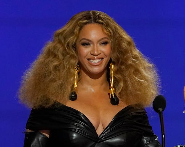 FILE - Beyonce appears at the 63rd annual Grammy Awards in Los Angeles, on March 14, 2021. Beyoncé has been reborn again; this time it’s on a shimm
