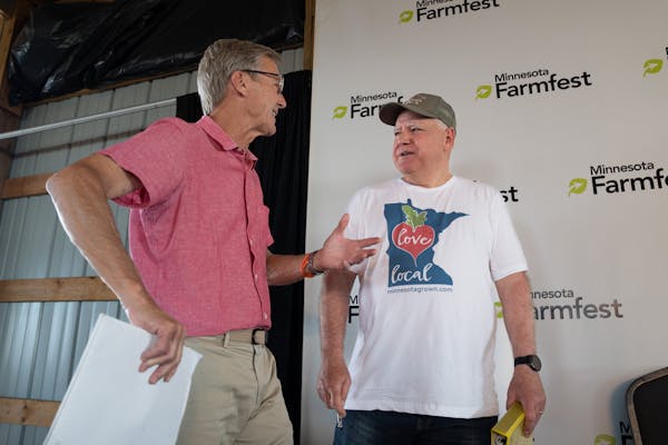 GOP candidate for governor Scott Jensen (left) and DFL Gov. Tim Walz talked before the Farmfest forum.