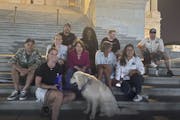 U.S. Sen. Amy Klobuchar on the U.S. Capitol steps with Amanda Barbosa, whose husband, former Army helicopter pilot Rafael Barbosa, was diagnosed with 