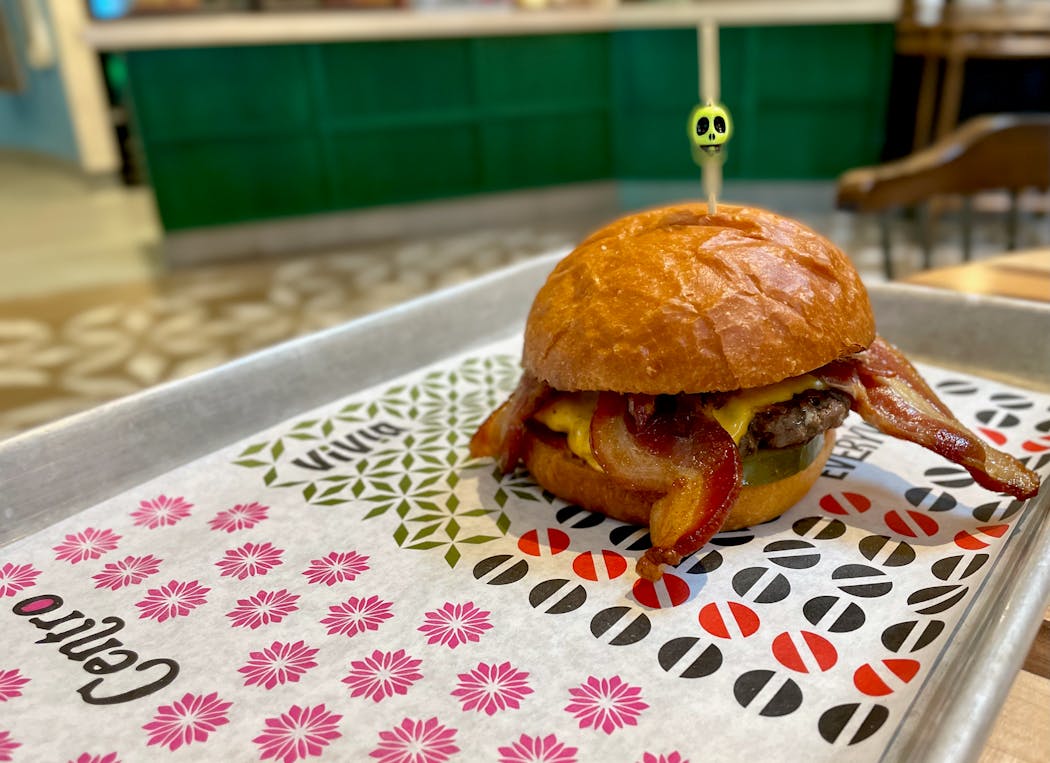 Everywhen Burger Bar’s Plain Jane gets an upgrade with two thick pieces of bacon.